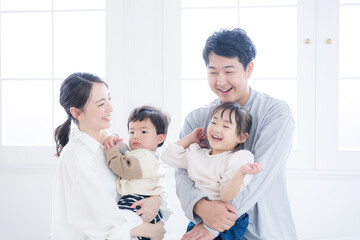 A scene of happy parenting with smiling faces A close-knit family