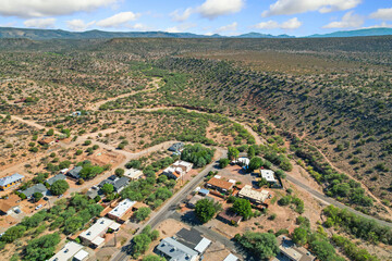 Fototapeta premium remote hillside community monitoring site, elevated rural settlement with natural landscape features
