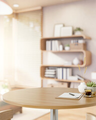 Pencil on clipboard and coffee aside plant on round wooden table in living room with bright sunlight