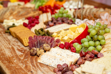 Large Charcuterie Board at an event with variety of finger foods	

