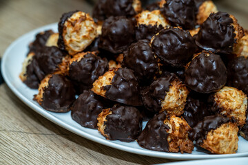 Chocolate Macaroon on a plate. Coconut dissert treat on a white plate.  