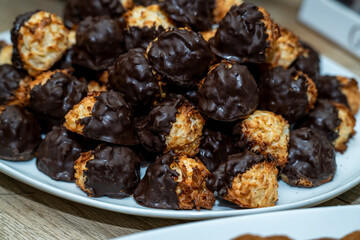Chocolate Macaroon on a plate. Coconut dissert treat on a white plate.  