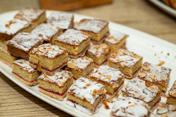 Almond raspberry dissert squares on a party tray