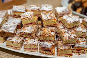 Almond raspberry dissert squares on a party tray