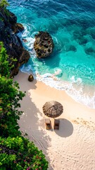 Aerial view of a white sand beach with clear turquoise water, dark cliffs, and tropical vegetation