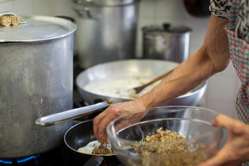 chef preparing pasta and food in the kitchen