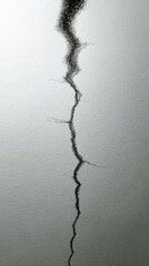 Vertical Crack on White Wall Surface Representing Structural Damage and Repair Needs