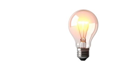 Lit incandescent lightbulb isolated on black background, radiating a warm, bright glow
