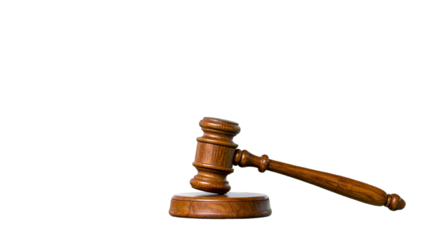 Wooden gavel on a block, angled right, against black background