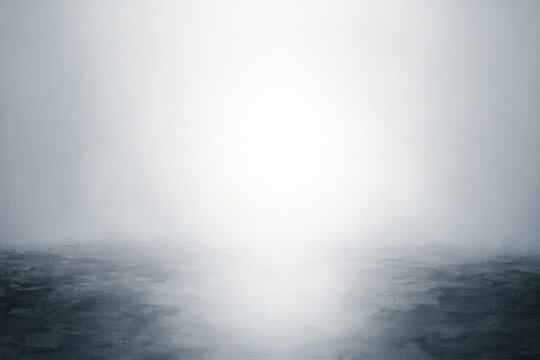 Foggy seascape with calm reflective water, pale central light and soft horizon conveying tranquil mysterious solitude