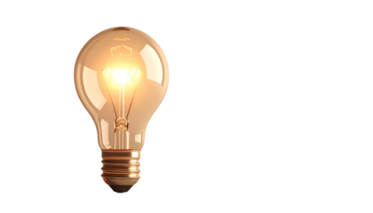 Lit incandescent lightbulb isolated against a stark black background, shining brightly