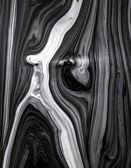 Abstract grayscale swirls create fluid, organic patterns. Lines and curves interweave, forming dynamic shapes and textures