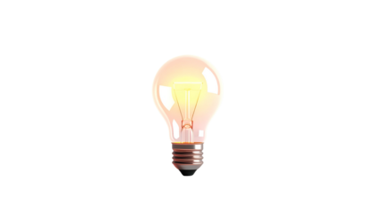 Illuminated classic light bulb glows against a black backdrop, filament clearly visible