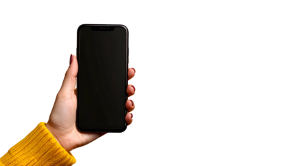 A hand holding a black rectangle device with a dark screen against a black background