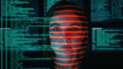 Futuristic facial recognition scan on an adult caucasian woman for biometric identity verification. Cybersecurity technology with laser grid scanning a face against computer code - Powered by Adobe