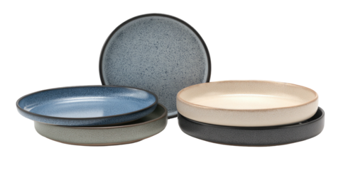 A set of textured stoneware plates in various neutral tones