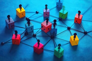 colorful wooden block network with small black silhouette figures connected by black strings and beads on blue surface conveying collaboration and connectivity