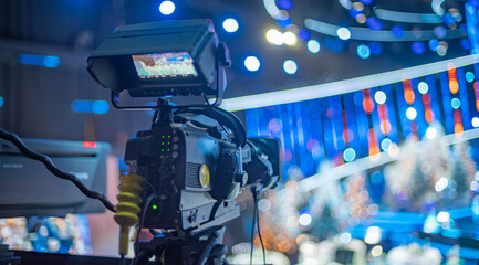 camera on the set of a Christmas TV show