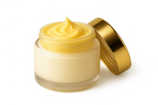 Yellow beauty cream in an open glass jar, showing luxurious skincare product for wellness and anti-aging with a golden cap