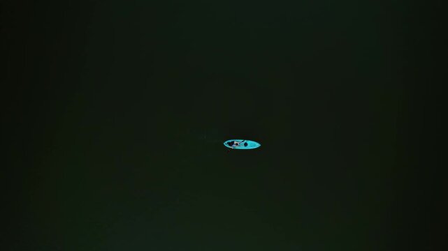 A lone kayak drifts over dark green water in Utah&rsquo;s Tibble Fork Reservoir Aerial