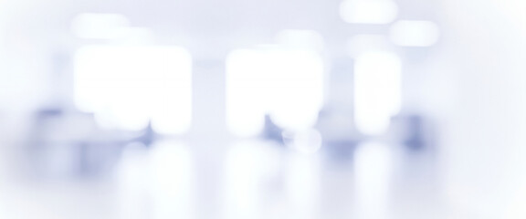 Bright abstract background with soft blue and white light blurs, creating a calm luminous ambience with gentle glowing highlights and smooth visual depth throughout the scene.