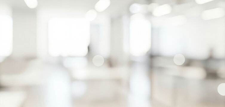 Bright abstract background of a modern interior space with soft focus, creating a calm luminous ambience with gentle glowing highlights and smooth visual depth throughout the scene.