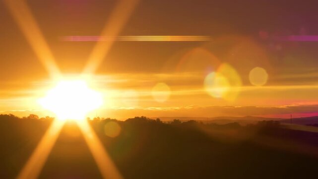 Intense cinematic warm residual light flare radiating softly across the frame during a vibrant golden hour sunset creating beautiful diffraction artifacts texture, slowmotion, commercial