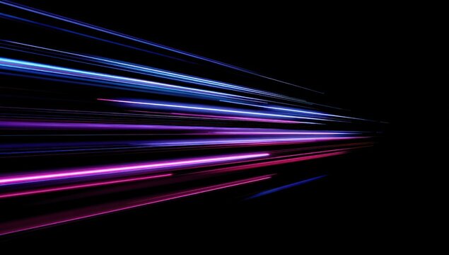 Abstract light trails moving fast against a black background.