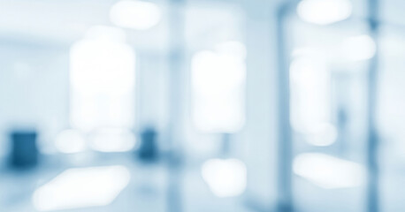 Abstract bright interior background with soft blue and white light bokeh, creating a calm glowing ambience that feels clean and modern with gentle luminous highlights across the space.