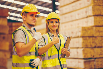 Wood factory worker man having injure at work. Man worker feeling pain in his leg from accident while working in warehouse.. Safety, Industry, Healthcare, Insurance Concept.