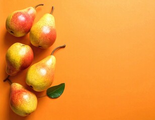Ripe Pears on Orange Background - Fresh Fruit Still Life.