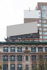 Blank billboard on top of Manhattan building in downtown New York City.