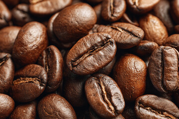 Fototapeta premium Roasted coffee beans, brown color, shiny texture