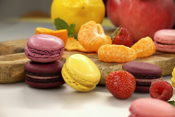 Vibrant scene of table filled with macaroons and fruits