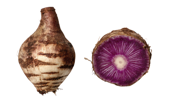 Whole and sliced root vegetable with purple interior and brown skin