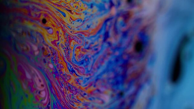 Vertical video. Holographic swirl. Gasoline paint. Color soap spill film multilayer art reflection. Bright mix defocused abstract texture background.