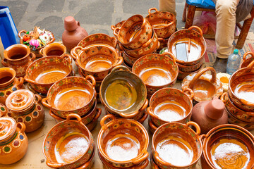 Rustic Handmade Mexican Clay Pottery Bowls and Pitchers at Outdoor Market