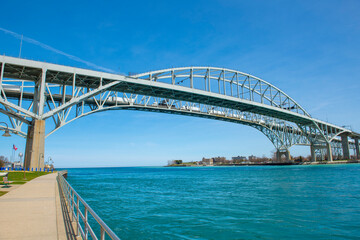 Naklejka premium Blue Water Bridge is an international bridge across the St. Clair River links Port Huron, Michigan, USA and Point Edward, Ontario, Canada. 