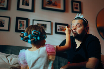Daughter Applying Makeup with Brush on her Dad Wearing a Tiara. Carrying dad being a model father...