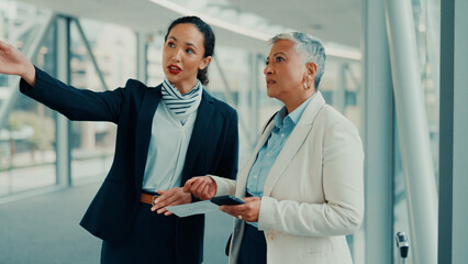 Woman, worker and help with pointing at airport for terminal directions, work trip or boarding flight. Corporate travel, gate agent and mature person with air ticket for departure or customer service