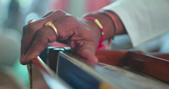 Cinematic Shot of Harmonium Playing During Devotional Program in Mandir