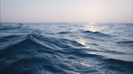 Element. Calm sea surface with gentle waves and soft sunlight. Ripples in the ocean. Swimming here is a pure joy