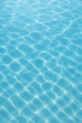 Obraz premium Serene turquoise water surface with sunlight creating mesmerizing patterns, perfect for summer vibes, vacation spots, and calm backgrounds.