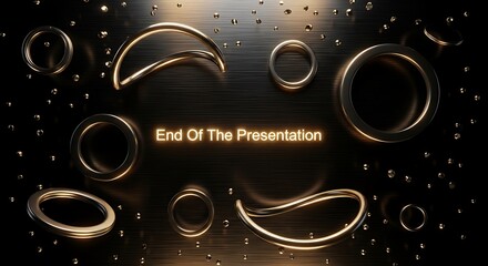 Golden rings and curved shapes on a dark surface with small drops scattered around it