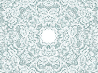 Detailed lace pattern in a light teal with white space in the middle