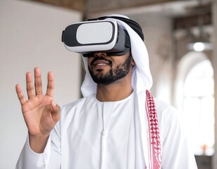 Man in traditional attire uses VR headset, raising hand in a contemporary architectural space