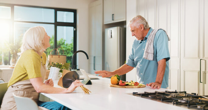 Tablet, flowers and cooking with old couple in kitchen of home for anniversary celebration, romance and gift. Love, present and online recipe with senior man and woman in house for date and meal prep - Powered by Adobe