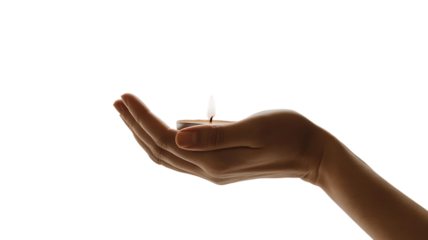 A hand holding a small lit candle on a transparent background