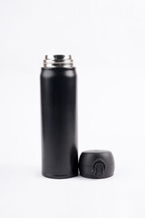 The bright white backdrop highlights the bottle’s shape and modern design