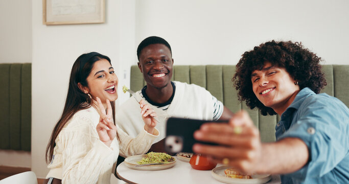 Restaurant, happy and selfie of friends with peace sign for social media, memory and online post. Hangout, cafe and men with woman take photo, picture and emoji for bonding, relax and meal together - Powered by Adobe